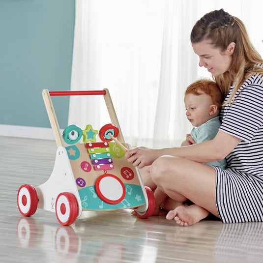 Hape muzikale loopwagen - loophulp met trommel, xylofoon en verstelbare weerstand - vanaf 10 maanden