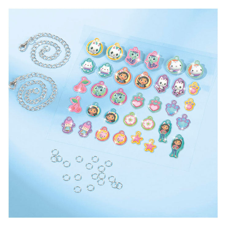 Afbeelding laden in galerijviewer, Totum gabby’s poppenhuis 2 bedel armbandjes maken - gabby’s dollhouse knutselset sieraden vriendschapsarmbanden knutselen cadeau meisjes vanaf 3 jaar
