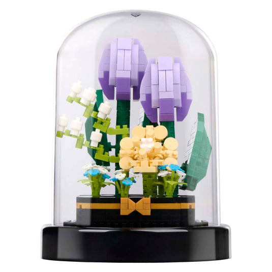 Bouwblokken bloemen in glazen stolp
