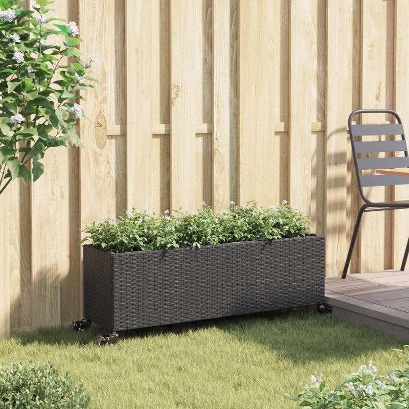 Load image into Gallery viewer, Vidaxl plantenbak met wielen 3 potten 107x32x38 cm poly rattan zwart
