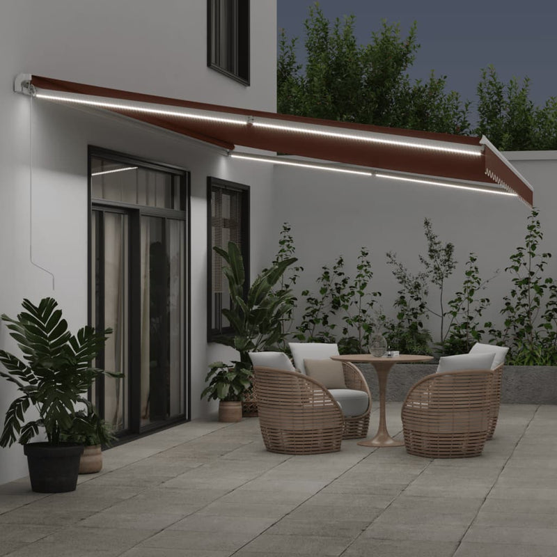 Load image into Gallery viewer, VidaXL Luifel handmatig uittrekbaar met LED 600x300 cm bruin
