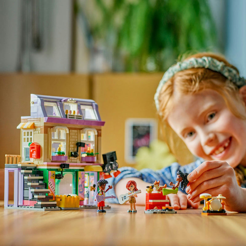 Afbeelding laden in galerijviewer, Lego friends - muziekwinkel en appartement constructiespeelgoed (42653)
